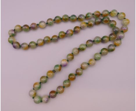 A string of large jade beads.  Approximately 88 cm long. 