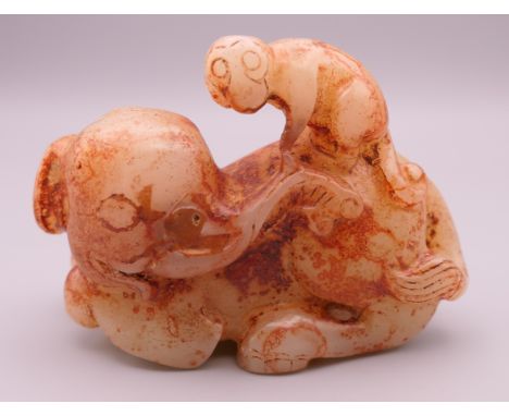 A russet jade model of an elephant and monkey. 8.5 cm long. 