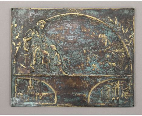 A small bronze plaque. 12 cm wide.