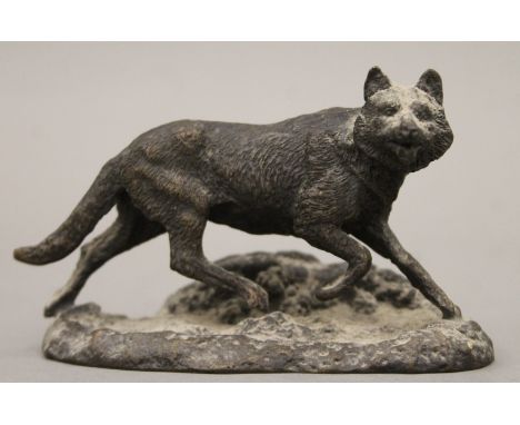 A patinated bronze model of a fox. 10.5 cm long.