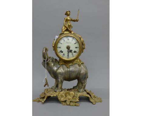 A cast metal elephant form mantle clock. 41 cm high.