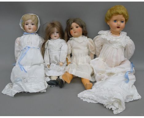 Three 19th century bisque headed dolls and a later doll.