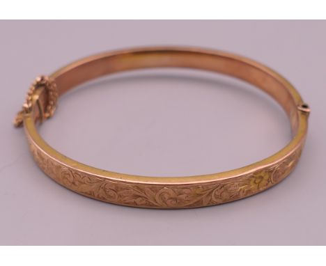 A 9 ct gold bangle form bracelet.  5.75 cm internal diameter. 8 grammes.