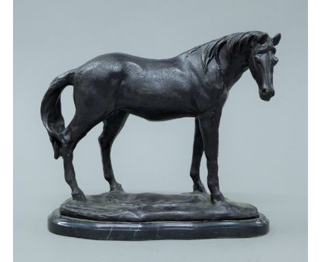 A bronze model of a horse. 22.5 cm high.