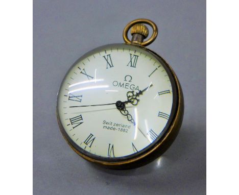 A ball clock. 8 cm high.