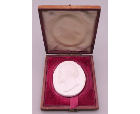 A boxed plaster intaglio depicting a bearded gentleman.  5.5 cm x 4.5 cm. 