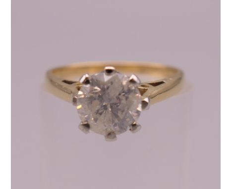 An 18 ct gold diamond solitaire ring (1 carat diamond).  Ring size J/K.