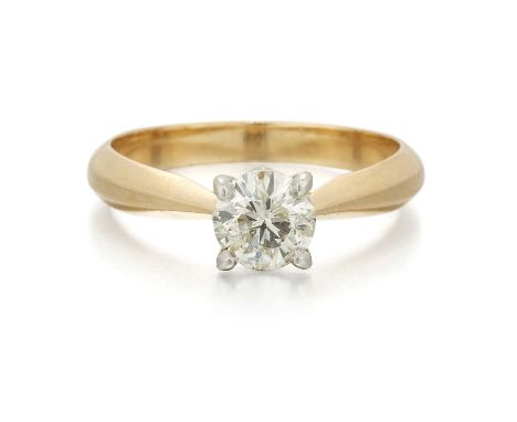 AN 18 CARAT GOLD SOLITAIRE DIAMOND RING a round brilliant-cut diamond in a claw setting. Estimated diamond weight 0.65ct, hal