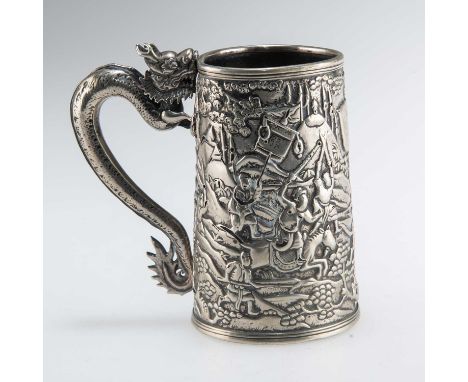 A 19TH CENTURY CHINESE EXPORT SILVER MUG by Shan, Canton, tapering cylindrical with dragon-form handle, chased with battle sc