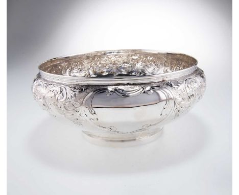 A VICTORIAN SILVER BOWL by Mappin &amp; Webb Ltd, London 1899, circular, chased with scrolling foliage. 25cm diameter, 22.5 t