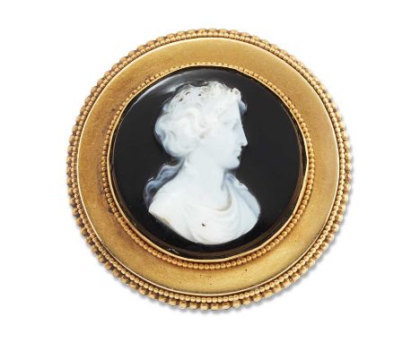 A MID 19TH CENTURY SARDONYX CAMEO BROOCH depicting a classical female bust within a beaded circular frame. 3cm diameter, 8.4 