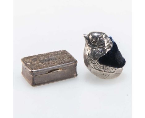 AN EDWARDIAN SILVER NOVELTY PIN CUSHION by Sampson Mordan &amp; Co Ltd, Chester 1907, in the form of a chick; together with a