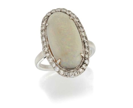 AN OPAL AND DIAMOND CLUSTER RING an oval opal within a border of round brilliant-cut diamonds, above a scroll gallery. Estima