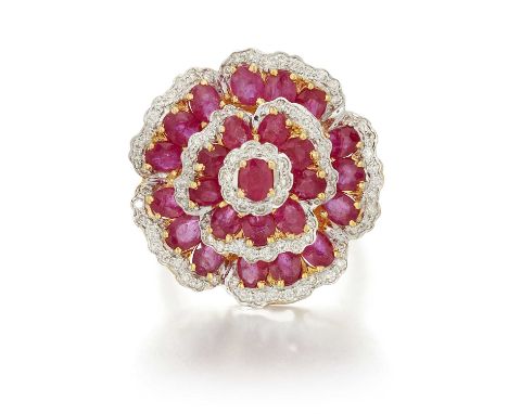 A RUBY AND DIAMOND CLUSTER DRESS RING the flower motif bezel set throughout with oval-cut rubies and round brilliant-cut diam