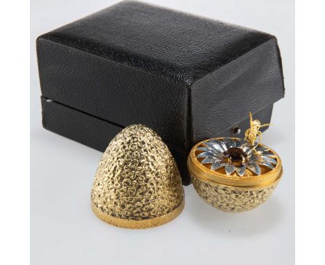 STUART DEVLIN: AN ELIZABETH II SILVER-GILT SURPRISE EGG by Stuart Devlin, London 1967, the textured and planished egg opening