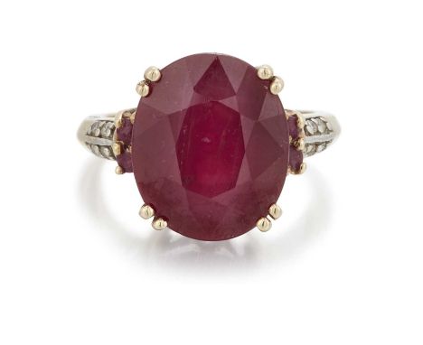 A 9 CARAT GOLD RUBY AND DIAMOND RING an oval-cut ruby to ruby and diamond-set shoulders. Hallmarked Birmingham 2011, ring siz