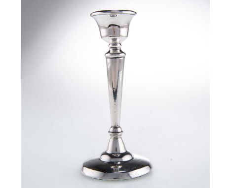 A GEORGE VI SILVER CANDLESTICK by E &amp; J Leek, Birmingham 1947, tapering cylindrical with a knopped stem, raised on a spre