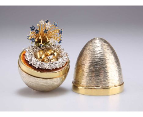 STUART DEVLIN: AN ELIZABETH II SILVER-GILT SURPRISE EGG by Stuart Devlin, London 1982, opening to reveal a hatching egg and t