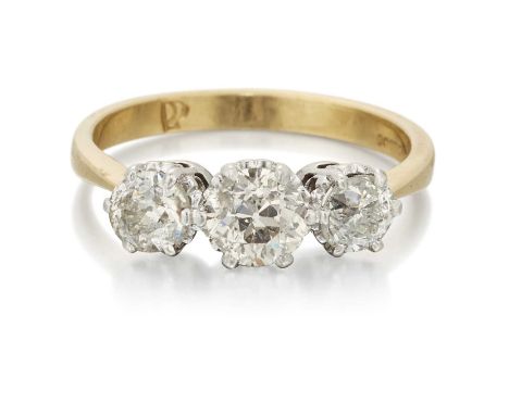 AN 18 CARAT GOLD DIAMOND THREE STONE RING graduated old-cut diamonds in claw settings. Estimated total diamond weight 1.35ct,