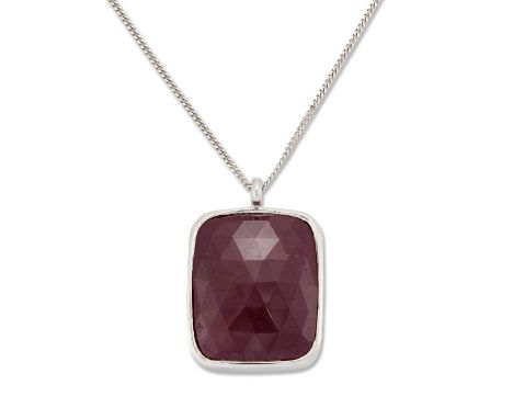 A RUBY PENDANT ON AN 18 CARAT WHITE GOLD CHAIN a cushion checkerboard-cut ruby in a bezel setting, to a fine Cuban link chain