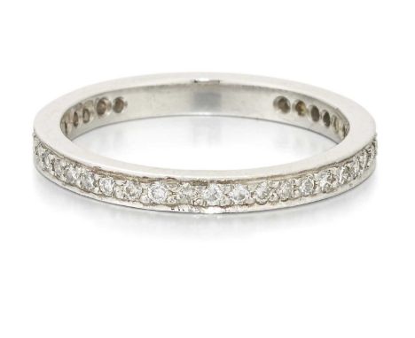 A DIAMOND ETERNITY RING round brilliant-cut diamonds in a milgrain setting. Estimated total diamond weight 0.25ct, ring size 