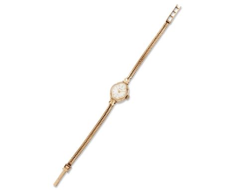 A 9 CARAT GOLD ACCURIST BRACELET WATCH the quatrefoil-shaped silvered dial signed Accurist 21 Jewels with faceted terminals a