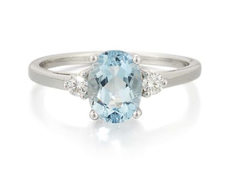 A PLATINUM AQUAMARINE AND DIAMOND THREE STONE RING an oval-cut aquamarine spaced by round brilliant-cut diamonds. Estimated t