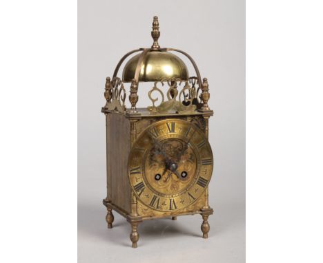 A Victorian brass cased lantern clock. Housing an 8 day movement with platform escapement and chiming on a bell, 30cm. Mechan