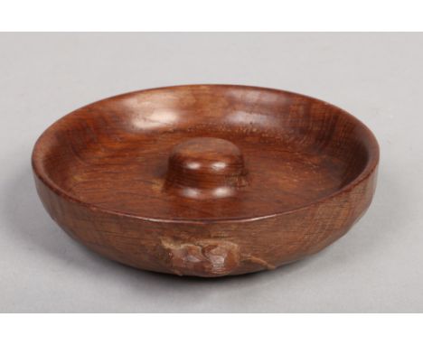 A Robert Thompson Mouseman pipe ash dish. With adzed side and having carved mouse motif, 13.75cm wide. Very good condition.