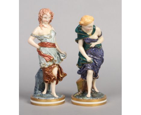 A pair of Royal Worcester figures. Before the Wind and Against the Wind in Raphaelesque colours. Printed puce marks, date cod