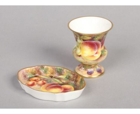 A porcelain specimen vase and lozenge shaped pin dish painted by Bryan Cox (Royal Worcester Artist). Both decorated with peac
