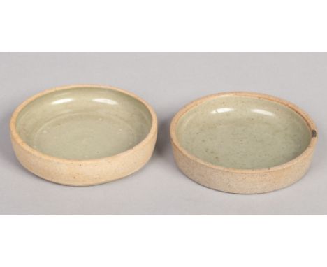 A pair of St Ives studio pottery dishes with celadon glaze in the manner of Bernard Leach. Impressed St Ives marks, 12cm diam