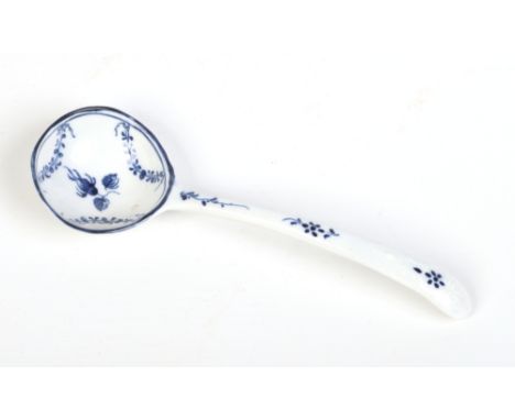 A rare Caughley small ladle. With delicate scroll and shell mouldings, painted in underglaze blue with a rose hip and leafy s