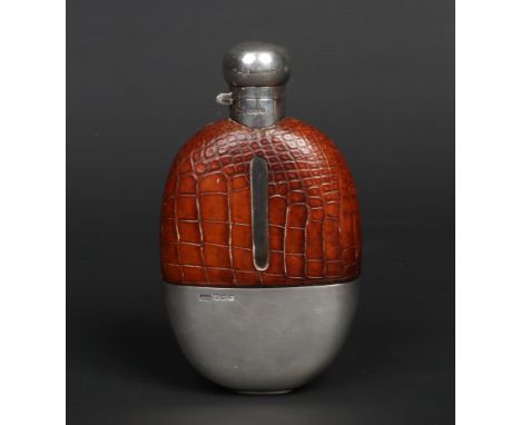 A George V silver and glass hip flask mounted in crocodile skin by Walker &amp; Hall. Assayed Sheffield 1917, 16.5cm. Good co