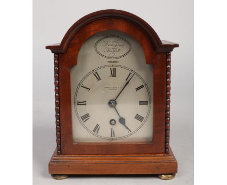 A mahogany cased dome top bracket clock of small proportions. With silvered arch top dial signed Brierly Wood &amp; Co. Glasg