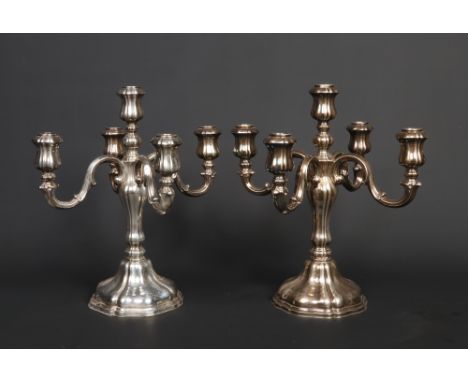 A pair of German silver five branch candelabra of scalloped form. 830s Halbmond und Reichskrone marks, 2252 grams, 38cm high.