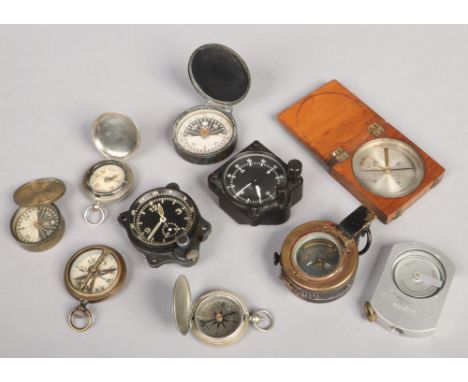 Seven pocket compasses including a World War II T. G. &amp; Co Mk III and Singers Patent along with two cockpit chronographs 