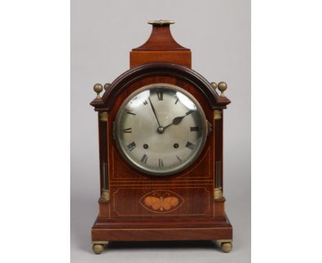 A Victorian inlaid mahogany bracket clock. With architectural pagoda top case having fluted quarter columns, ball finials, st