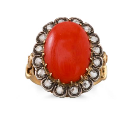 A CORAL AND DIAMOND CLUSTER RING, the cabochon coral to rose cut diamond surround in yellow gold mount, size N