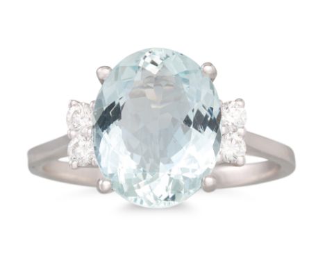 AN AQUAMARINE AND DIAMOND RING, the oval aquamarine to diamond shoulders, in 18ct white gold. Estimated: weight of diamonds: 