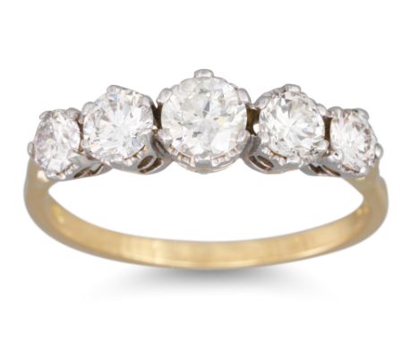 A FIVE STONE DIAMOND RING, the graduated brilliant cut diamonds mounted in 18ct yellow gold. Estimated: weight of diamonds: 1