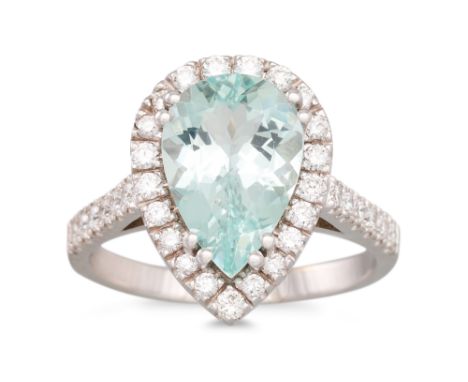 AN AQUAMARINE AND DIAMOND CLUSTER RING, pear shaped aquamarine to diamond surround and shoulders, mounted in 18ct white gold.