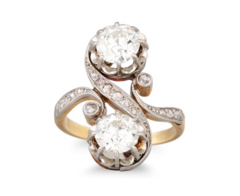 AN EDWARDIAN DIAMOND TOI ET MOI RING, set with old and rose cut diamond detail, in yellow and white gold. Estimated: weight o