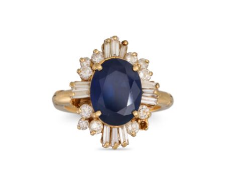 A DIAMOND AND SAPPHIRE CLUSTER RING, the oval sapphire to a brilliant cut &amp; baguette diamond surround, mounted in 14ct ye