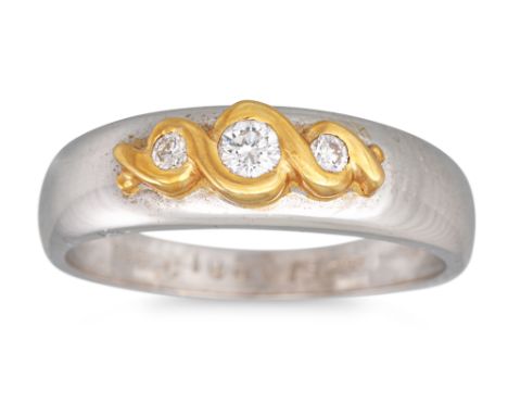 A THREE STONE DIAMOND RING, mounted in 18ct two colour gold, size N