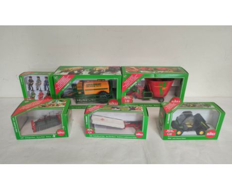 Quantity of Siku 1:32 scale boxed agricultural implements&nbsp; to include a fodder mixing wagon 2450, a crop sprayer 2563 &a