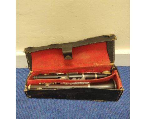 Antique pre 1930 Boosey &amp; Co dark rosewood clarinet, serial no. 16316, in defective leather case. 