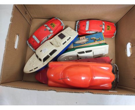 Vintage 1950s clockwork and friction powered toys to include a Tri-ang Burnham model boat in plastic, another similar but die