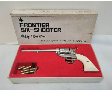 Vintage Japanese MGC replica of a Colt M1873 Frontier Six Shooter Model P Cal. 44-40 with faux ivory grip and brass cartridge