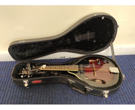 Stagg M50E electric mandolin in red burst finish, fitted in a Stagg case, with stand. 